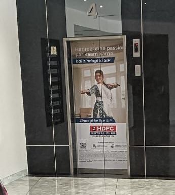 HDFC Mutual Fund branding on lift doors