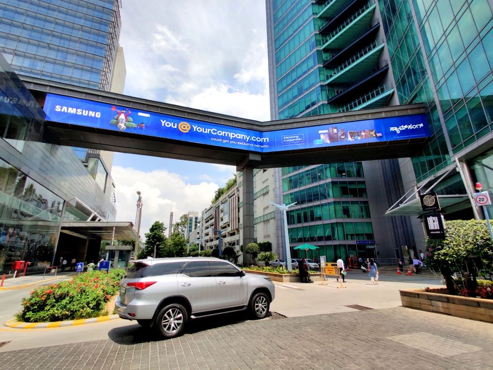 Samsung branding on a skywalk between tech park towers