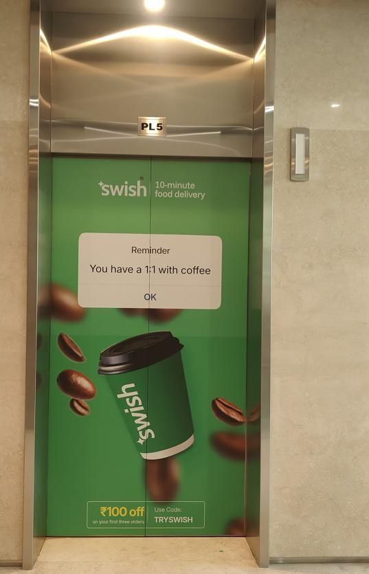 Swish ad wrapped on a lift door